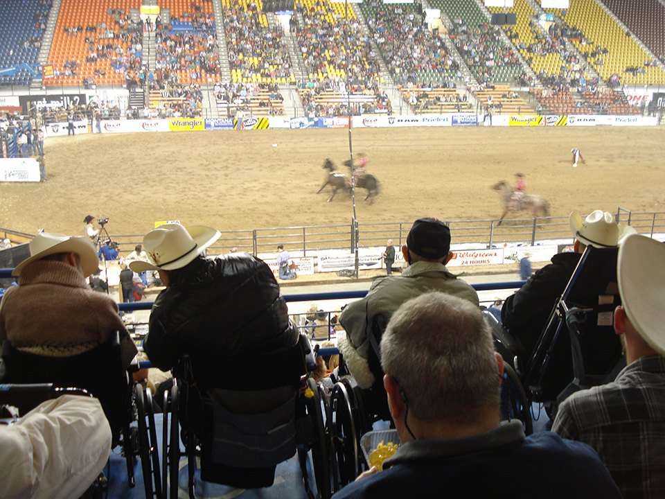View from the stands looking at Horses at a rodeo