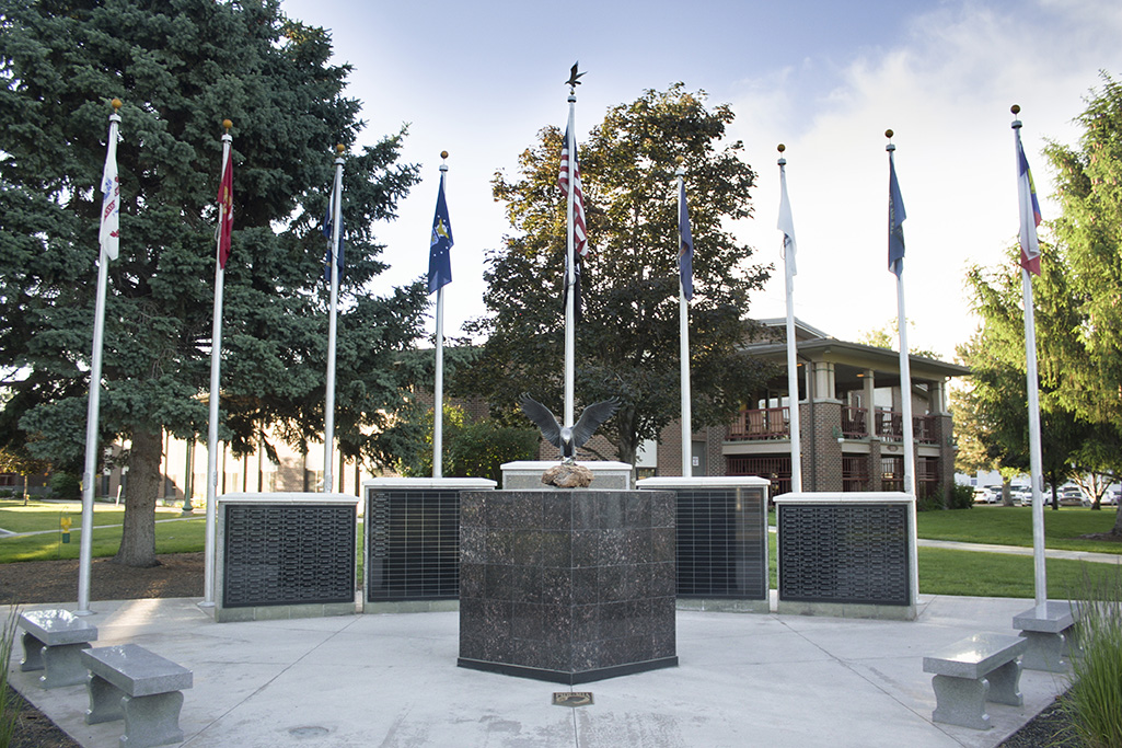 Memorial with Eagle in center of Veteran Organization Flags